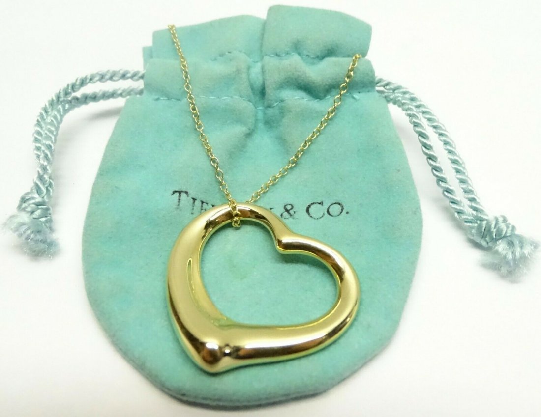 Tiffany & Co 18K Gold Elsa Peretti Open Heart Necklac: Tiffany and Co.18K 750 Solid Gold Elsa Peretti Open Heart Necklace Heart Size 27mm. Weight: 13.75g. Chain 27 in. In house shipping to continental US $15.