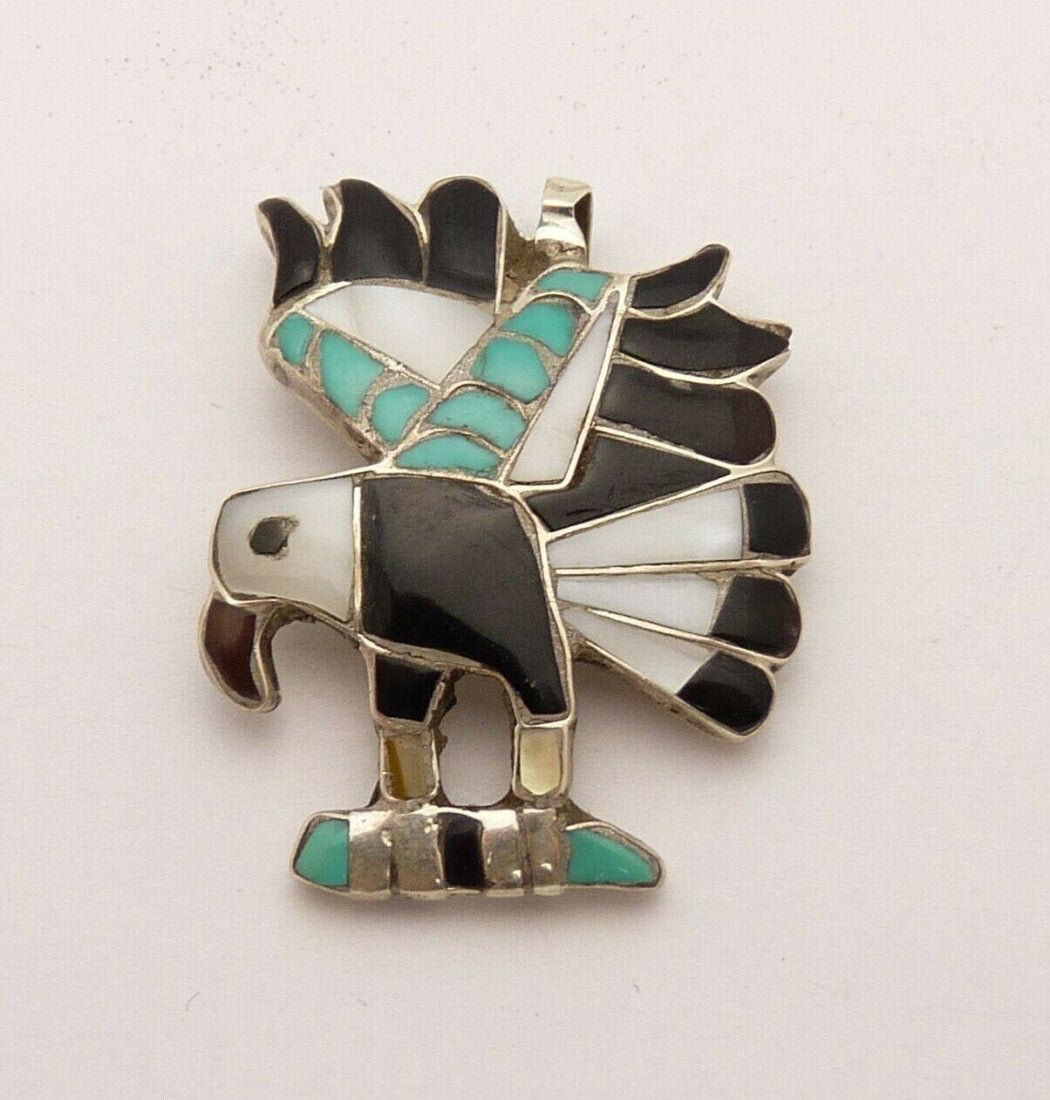 Navajo 925 Silver Turquoise Opal Onyx Eagle Pendant: Navajo Sterling Silver Turquoise Opal & Onyx Eagle Handcrafted Pendant. Weighs 4.4dwt/6.9g. Measures approximately 1" in length and 1.5" in height. In house shipping to continental US $15.