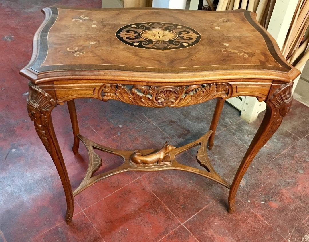 Antique Table Hand Carved American Indian & Dog: Antique early 20th cent. American walnut and rosewood hand carved beautiful table . measures 30" high , 32" by 20 inches top . In excellent condition .