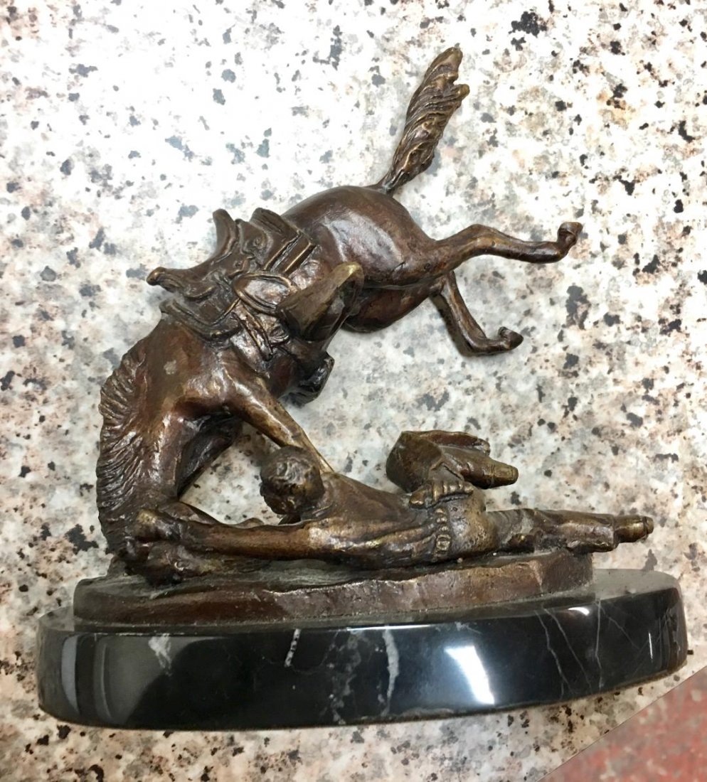 After Frederic Remington Bronze Sculpture Man Fallen: After Frederic Remington Bronze Sculpture on a marble base Man Fallen From The Horse. Signed on the base. Measures 7.5" x 7". In house shipping is available, buyer pays shipping cost.