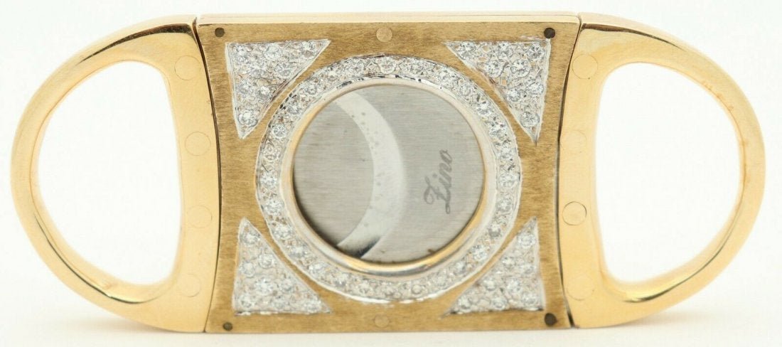 Davidoff Zino Diamonds Yellow Gold Plated Cigar Cutter: Davidoff Zino Diamonds Yellow Gold Plated Cigar Cutter. 60 round 0.03ct each H color diamonds on the front panel, total 1.8ct. Measures 3.3" x 1.4". In house shipping is available, buyer pays shipping