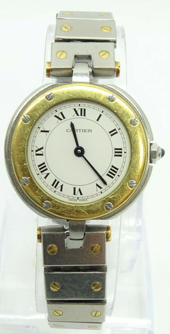 Cartier Santos 29mm Round Two Tone 18k Gold Watch: Cartier Santos 29mm Round Quartz Two Tone 18k Gold and Stainless Steel Ladies Watch. Wrist Size: apprx 7". Year of Manufacture:1990-1999. 9 jewels. In house shipping is available, buyer pays shipping 