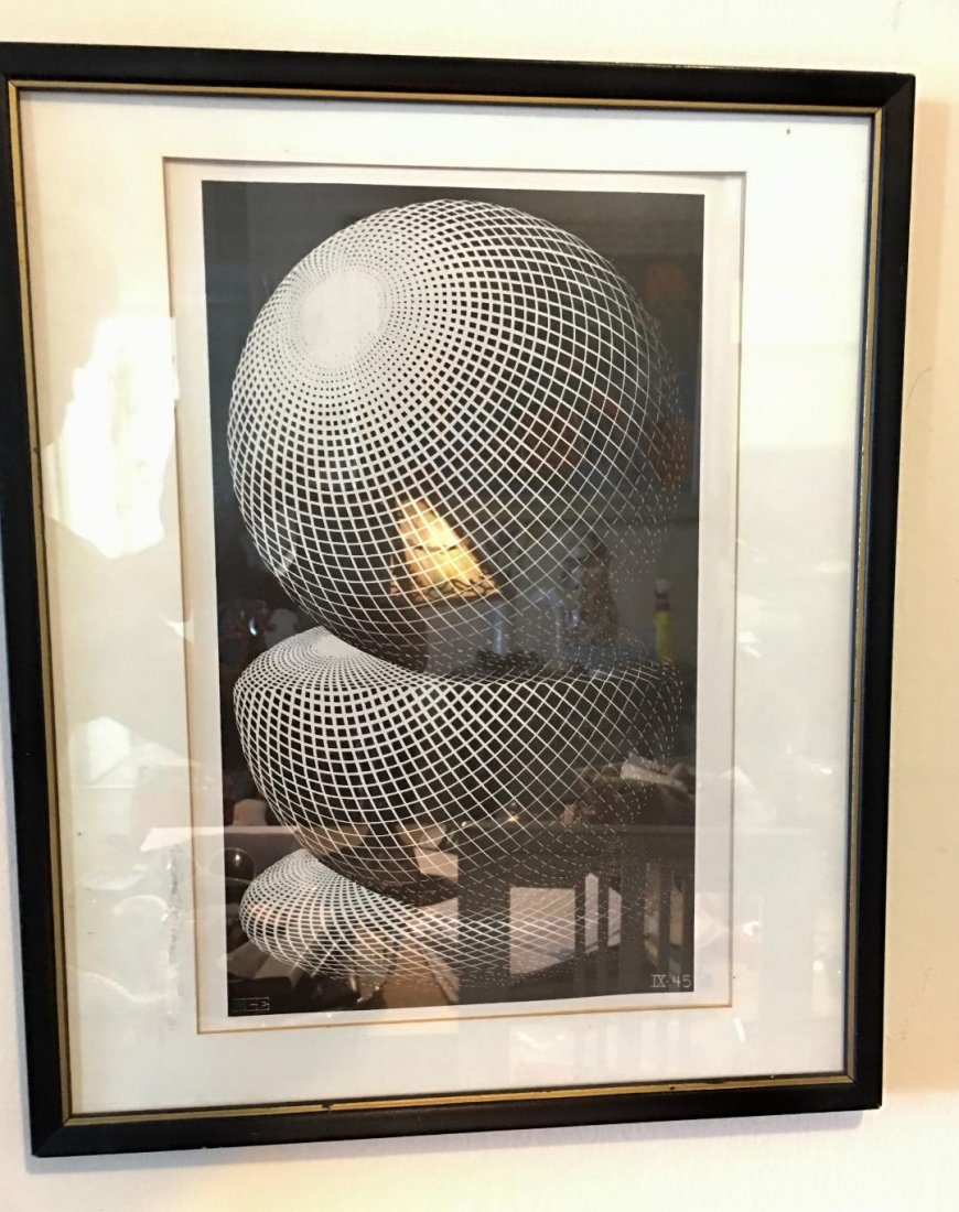 M.C. Escher (Netherlands 1898-1972) Graphic art print: Maurits Cornelis Escher (Netherlands, 1898-1972) Graphic art print / poster . Measures 18" x 21" framed. Not Examined Outside of frame. In house shipping is available, buyer pays shipping cost.