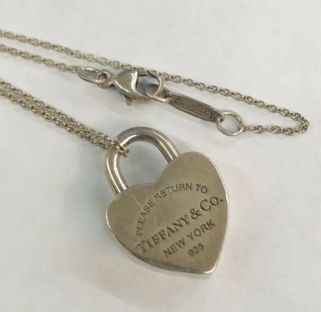 Return To Tiffany & Co Sterling Silver Padlock Heart Lo: Return To Tiffany & Co Sterling Silver Padlock Heart Lock Charm Pendant with 17" chain. In house shipping is available, buyer pays shipping cost. House id 07.