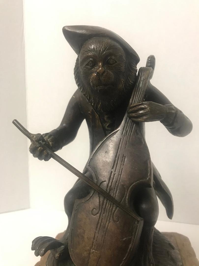 Bronze Monkey Musician Playing Cello Figurine: Bronze Monkey Musician Playing Cello Figurine. Measures 10" tall, base 6" x 6". In house shipping is available, buyer pays shipping cost