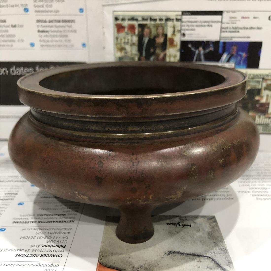 A Chinese Carved Bronze Tripod Censer: H.6.2 cm. D.12.5 cm. Weight.1000 gram.