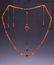 A Chinese Carved Amber Court Necklace