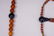 A Chinese Carved Amber Court Necklace - 4