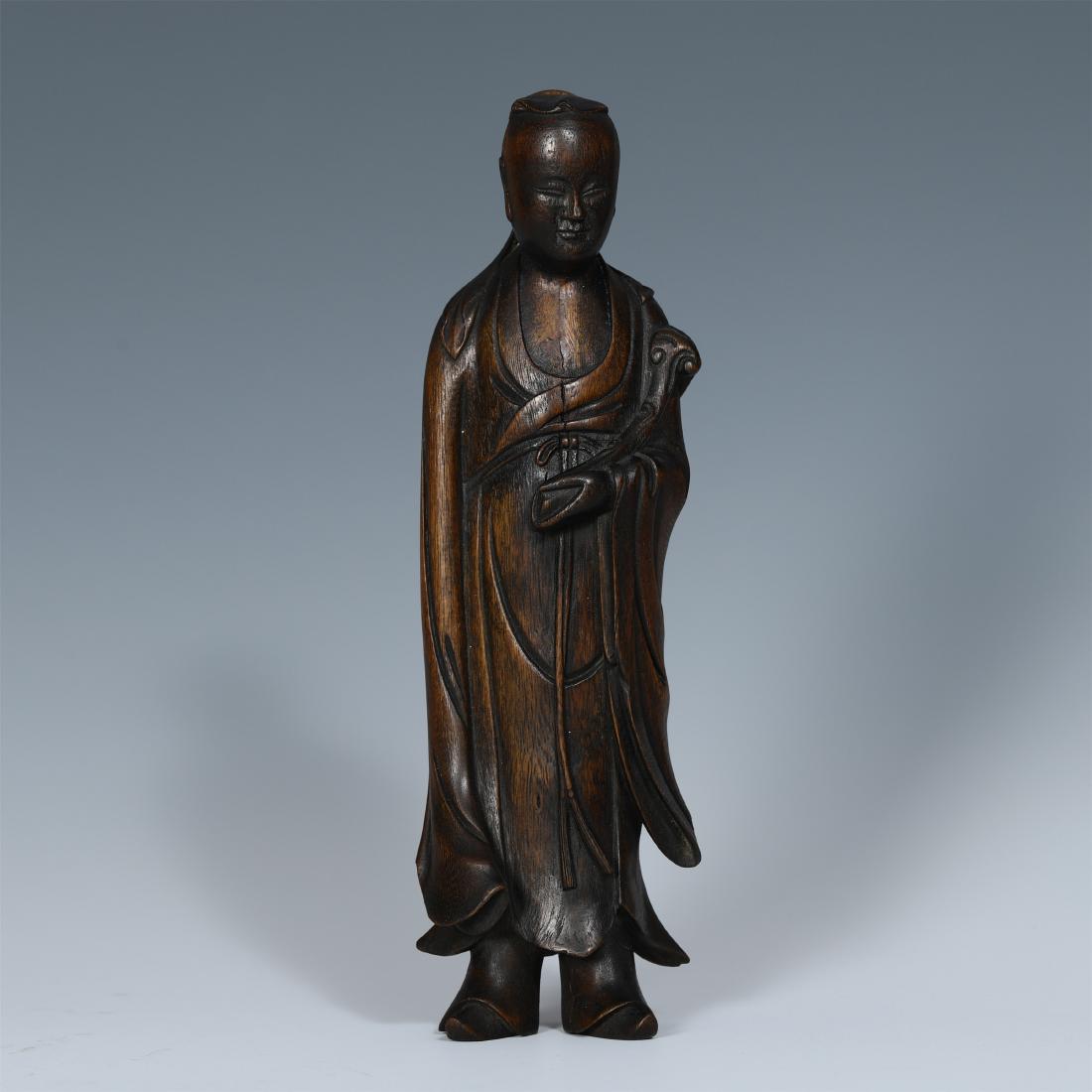 A Chinese Aloeswood Figure of Scholar: 25.8*8*5.3 cm. Weight 140 gram.