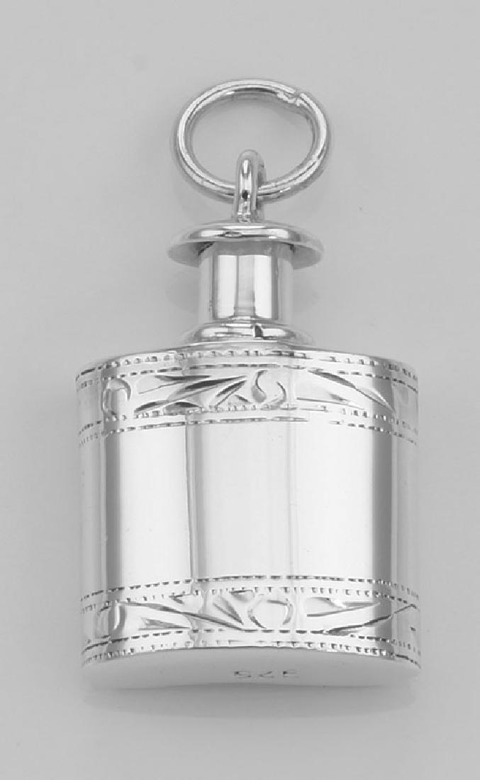 Mini Flask Perfume Bottle Pendant in Fine Sterling Silv: Mini Flask Perfume Bottle Pendant in Fine Sterling Silver **|**|** #X-135 This Sterling Silver Mini Flask Perfume Pendant Bottle measures approx. 1 inch H by 3/4 inch W and weighs approx. 6.6 grams. s