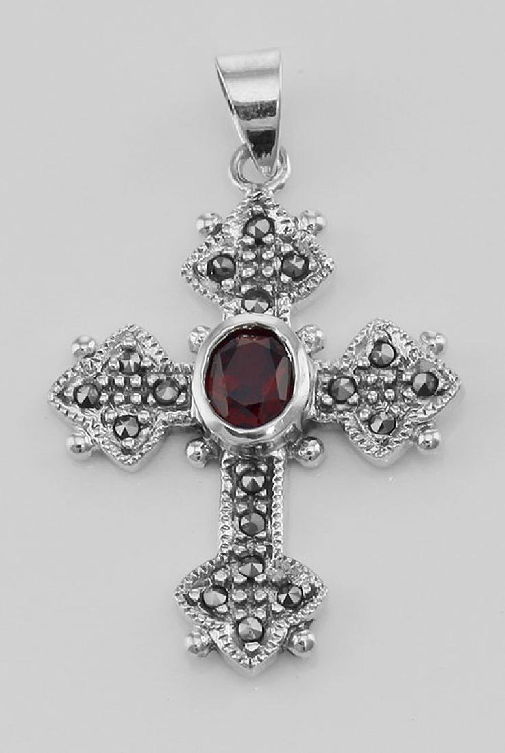 Marcasite Cross Pendant with Garnet - Sterling Silver: Marcasite Cross Pendant with Garnet - Sterling Silver **|**|** #CR-52-G This Sterling Silver Marcasite and Garnet Cross Pendant measures approx. 7/8 inch W x 1 1/4 inches H. This Cross pendant is new 