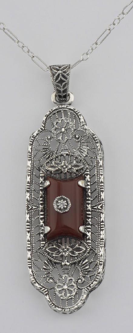 Beautiful Red Carnelian Filigree Pendant w/ Diamond - S: Beautiful Red Carnelian Filigree Pendant w/ Diamond - Sterling Silver **|**|** #FP-62-CAR This vibrant red carnelian filigree pendant is handcrafted with intricate sterling silver detail. A sparkling 
