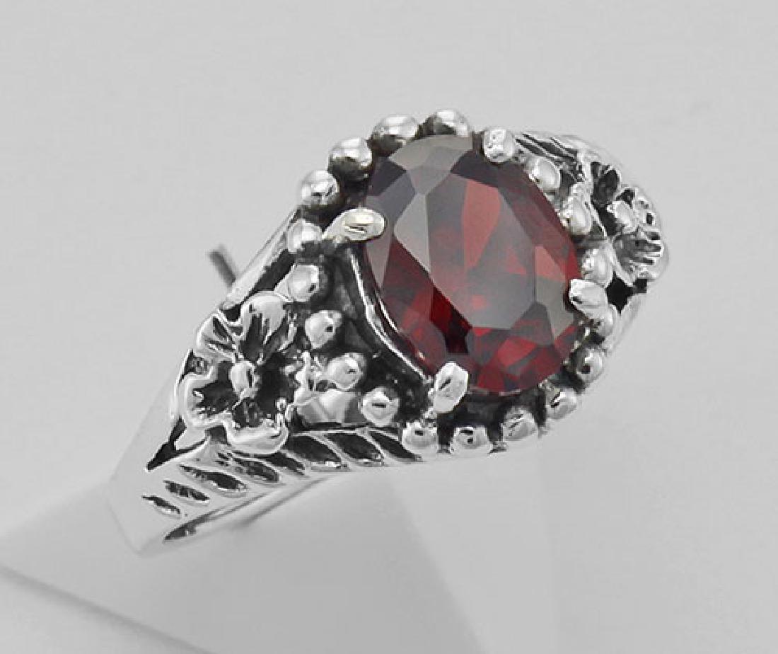 Synthetic Garnet Ring - Sterling Silver: Synthetic Garnet Ring - Sterling Silver **|**|** #R-8883-G Metal : Sterling Silver | Stone : Syn. Garnet | Style : Ring | Height : 3/8 inch | Width : 3/4 inch | Approximate Weight : 3.1 grams | Carat 