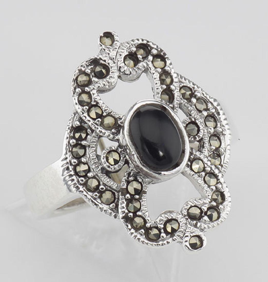 Antique Style Black Onyx and Marcasite Ring - Sterling: Antique Style Black Onyx and Marcasite Ring - Sterling Silver **|**|** #R-396 This unique Onyx Ring features a Oval Cabachon cut Black Onyx Gemstone surrounded by Marcasites in a very stylish antique 