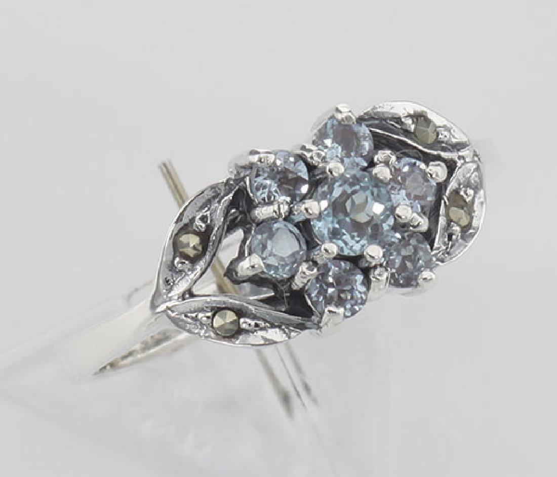 Beautiful Blue Topaz Marcasite Ring - Flower Design - S: Beautiful Blue Topaz Marcasite Ring - Flower Design - Sterling Silver **|**|** #R-608-BT Blue Topaz Marcasite Ring - This beautiful ring has 7 round brilliant cut blue topaz stones arranged in lovely 
