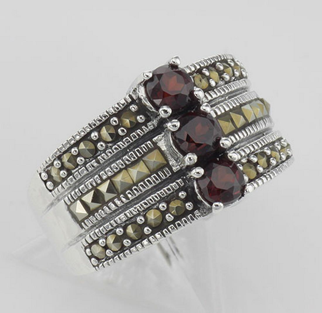 3 Stone Genuine Red Garnet and Marcasite Ring - Sterlin: 3 Stone Genuine Red Garnet and Marcasite Ring - Sterling Silver **|**|** #R-412 Sterling Silver Three Stone Garnet Ring with Marcasite. This ring features 3 round brilliant cut Garnets stacked one on 