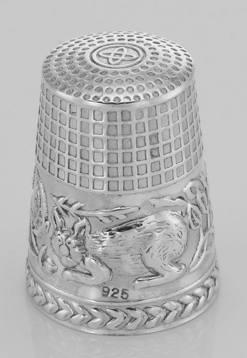Cute Cat Sewing Thimble in Fine Sterling Silver: Cute Cat Sewing Thimble in Fine Sterling Silver **|**|** #TH-149 Cute Cat Sewing Thimble - Sterling Silver 925. This item is new and a quality sterling silver antique and collectible reproduction. Met