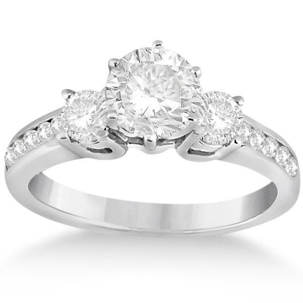 Three-Stone Diamond Engagement Ring with Sidestones in: Three-Stone Diamond Engagement Ring with Sidestones in 18k White Gold 1.45 ctw -- CENTER STONE; DIAMOND (1.00 CTW) CENTER STONE CLARITY; SI1-SI2 CENTER STONE COLOR; G-H CENTER STONE SETTING; SIDE STON