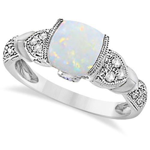 Tanzanite, Diamond and Opal Ring 14k White Gold 1.10ctw: Tanzanite, Diamond and Opal Ring 14k White Gold 1.10ctw -- CENTER STONE; Opal,Tanzanite CENTER STONE CLARITY; CENTER STONE COLOR; White,Pink CENTER STONE SETTING; Semi-bezel,Bezel SIDE STONE CLARITY; 