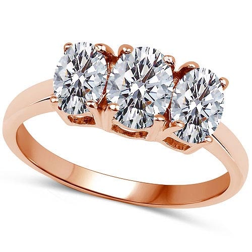 Certified .75 CTW Oval Diamond 14K Rose Gold Ring: Certified .75 CTW Oval Diamond 14K Rose Gold Ring -- Total Weight Of 3 Stone .75 CTW Oval Diamond Center Stone Clarity: SI2-I1 Center Stone Color G-H : White Diamond Stone Setting ;Prong 14K Rose Gold