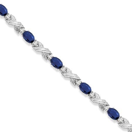Blue Sapphire and Diamond XOXO Link Bracelet in 14k White Gold 6.65ctw: Blue Sapphire and Diamond XOXO Link Bracelet in 14k White Gold 6.65ctw -- CENTER STONE; Sapphire CENTER STONE CLARITY; CENTER STONE COLOR; Blue CENTER STONE SETTING; Prong SIDE STONE CLARITY; SI SIDE 