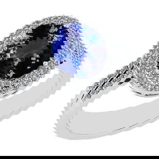 3.68 Ctw VS/SI1 Tanzanite And Diamond 14K White Gold halo Ring: Center Stone Approx Weight: 3.03 Ctw (Oval Cut) Center Stone Color: Tanzanite Center Stone Setting: Prong Side Stone 0.65 Ctw Side Stone Color: H-I Stone Clarity: VS/SI1 Stone Setting: Prong Metal App