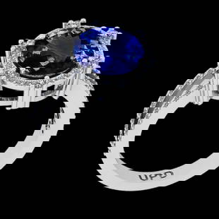 4.84 Ctw VS/SI1 Tanzanite and Diamond 14K White Gold Vintage Style Ring: Center Stone Weight : 4.22 Ctw ( Oval Cut) Center stone Color :-Tanzanite Center Stone Setting : Prong Side Stone Weight Of Ctw 0.62 Ctw Side Stone Color : J-K Stone Clarity : VS/SI1 Stone Setting : P