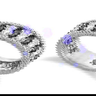 Diamond and Tanzanite Eternity Ring Band 14k White Gold 1.08ctw: CENTER STONE; Tanzanite CENTER STONE CLARITY; CENTER STONE COLOR; CENTER STONE SETTING; Prong SIDE STONE CLARITY; SI1-SI2 SIDE STONE COLOR; J-K SIDE STONE SETTING; Prong ctw OF SIDE STONE: 0.5 SIDE ST