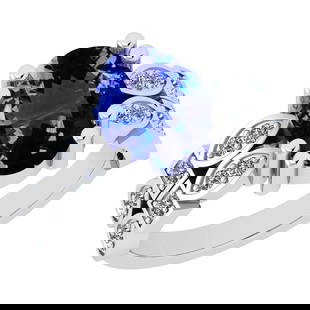 4.68 Ctw VS/SI1 Tanzanite And Diamond 14K White Gold Ring: Center Stone Approx Weight: 4.48 Ctw (Oval Cut) Center Stone Color: Tanzanite Center Stone Setting: Prong Side Stone 0.20 Ctw Side Stone Color: H-I Stone Clarity: VS/SI1 Stone Setting: Prong Metal App
