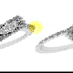 0.97 Ctw I2/I3 Treated Fancy Yellow And White Diamond 14K White Gold Vintag: Center Diamond Weight : 0.50 Ctw ( Round Cut) Center Color :-Treated Fancy Yellow Diamond Center Stone Clarity :- I2/I3 Center Stone Setting : Prong Side Stone Weight Of Ctw 0.47 Ctw Side Stone Color