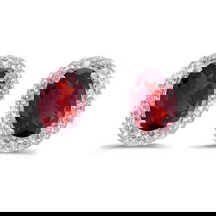 Diamond and Ruby Earrings in 14k White Gold 1.20ctw: CENTER STONE; Ruby CENTER STONE CLARITY; CENTER STONE COLOR; Red CENTER STONE SETTING; Prong SIDE STONE CLARITY; SI SIDE STONE COLOR; I-J SIDE STONE SETTING; Pave ctw OF SIDE STONE: 0.02 SIDE STONE