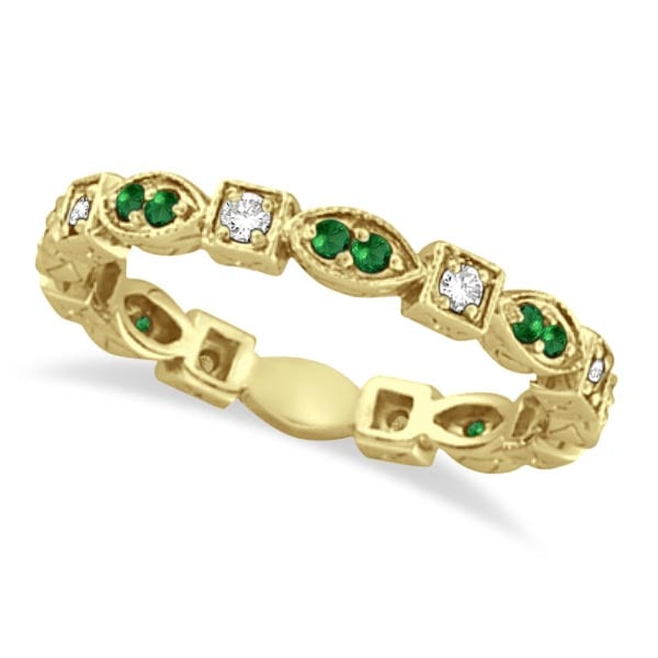 Emerald and Diamond Eternity Ring Anniversary Band 14k Yellow Gold: CENTER STONE; Diamond CENTER STONE CLARITY; SI CENTER STONE COLOR; J-K CENTER STONE SETTING; Prong SIDE STONE CLARITY; SIDE STONE COLOR; Green SIDE STONE SETTING; Prong ctw OF SIDE STONE: 0.24 SIDE ST