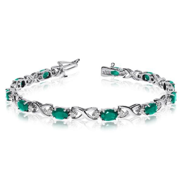 Oval Emerald and Diamond XOXO Link Bracelet 14k White Gold 7.00ctw: CENTER STONE; Emerald CENTER STONE CLARITY; CENTER STONE COLOR; Green CENTER STONE SETTING; Prong SIDE STONE CLARITY; SI SIDE STONE COLOR; J-K SIDE STONE SETTING; Prong ctw OF SIDE STONE: 0.4 SIDE STO