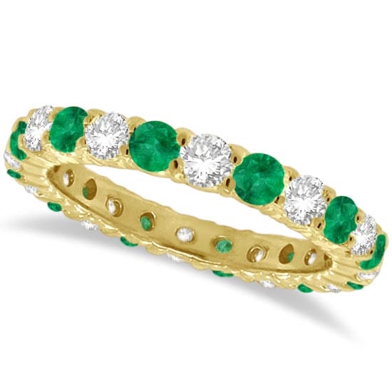 Emerald and Diamond Eternity Ring Band 14k Yellow Gold 1.07ctw: CENTER STONE; Emerald CENTER STONE CLARITY; CENTER STONE COLOR; Green CENTER STONE SETTING; Prong SIDE STONE CLARITY; SI SIDE STONE COLOR; J-K SIDE STONE SETTING; Prong ctw OF SIDE STONE: 0.5 SIDE STO