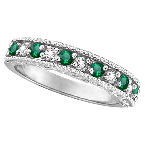 Designer Diamond and Emerald Ring Band in 14k White Gold 0.59 ctw: CENTER STONE; Emerald CENTER STONE CLARITY; CENTER STONE COLOR; Green CENTER STONE SETTING; Prong SIDE STONE CLARITY; SI SIDE STONE COLOR; J-K SIDE STONE SETTING; Prong ctw OF SIDE STONE: 0.23 SIDE ST