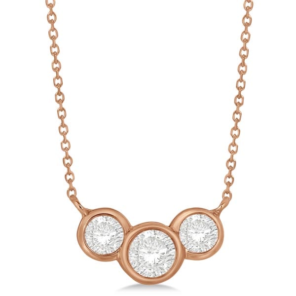 Three Stone Bezel Set Diamond Pendant Necklace 14k Rose Gold 1.00 ctw: CENTER STONE; Diamond CENTER STONE CLARITY; SI1-SI2 CENTER STONE COLOR; J-K CENTER STONE SETTING; Bezel SIDE STONE CLARITY; SIDE STONE COLOR; J-K SIDE STONE SETTING; Bezel ctw OF SIDE STONE: 0.52