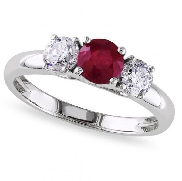 Ruby and Diamond Three Stone Engagement Ring in 14k White Gold 2.50ctw: CENTER STONE; Ruby (2.00 CTW) CENTER STONE CLARITY; Eye Clean CENTER STONE COLOR; Red CENTER STONE SETTING; Prong SIDE STONE CLARITY; SI1-SI2 SIDE STONE COLOR; J-K SIDE STONE SETTING; Pave ctw OF SIDE