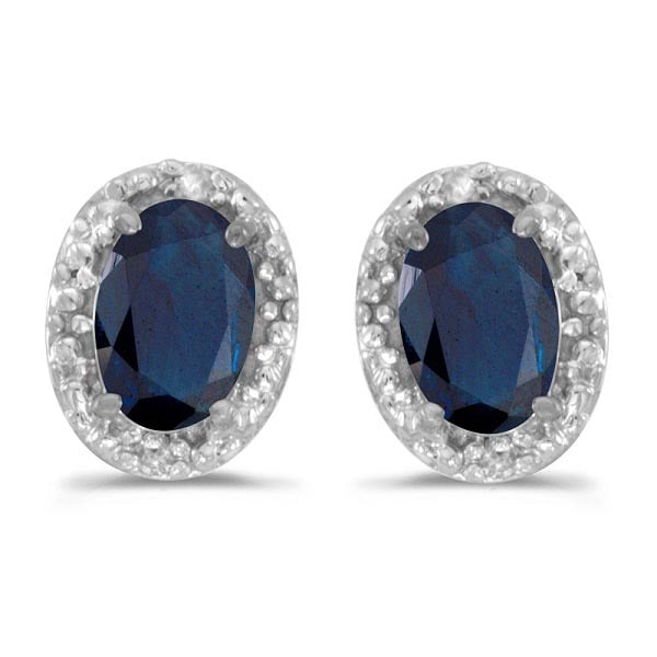Diamond and Blue Sapphire Earrings 14k White Gold 1.20ctw: CENTER STONE; Sapphire CENTER STONE CLARITY; CENTER STONE COLOR; Blue CENTER STONE SETTING; Prong SIDE STONE CLARITY; SI SIDE STONE COLOR; I-J SIDE STONE SETTING; Pave ctw OF SIDE STONE: 0.02 SIDE STO