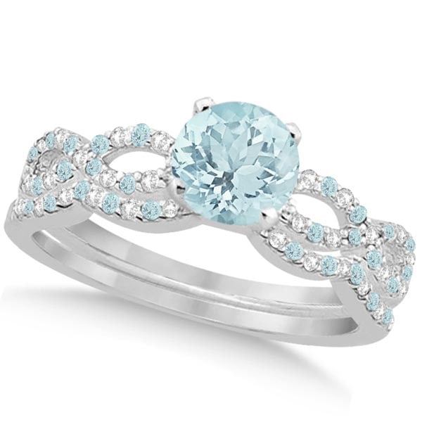 Aquamarine and Diamond Infinity Style Bridal Set 14k White Gold 1.64ctw: CENTER STONE; Aquamarine (1.00 cttw) CENTER STONE CLARITY; Eye Clean CENTER STONE COLOR; Blue CENTER STONE SETTING; Prong SIDE STONE CLARITY; Eye Clean, VS2-SI2 SIDE STONE COLOR; Blue,J-K SIDE STONE S