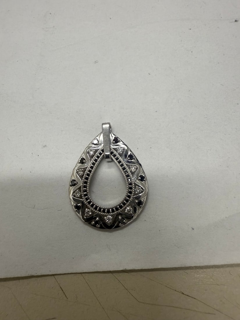 Black and White Diamond Pear Shaped Necklace in 14K White Gold 0.50ctw: METAL TYPE: 14k White Gold ;TOTAL CARAT WEIGHT: 0.5 ;NAME OF CENTER STONE: Diamond,Diamond ;CENTER STONE SHAPE: Round,Round ;CENTER STONE CLARITY: SI1-SI2#SI1-SI2 ;CENTER STONE COLOR: Black,G-h ;CENTE