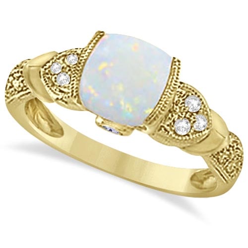 Tanzanite, Diamond and Opal Ring 14k Yellow Gold 1.10ctw: CENTER STONE; Opal,Tanzanite CENTER STONE CLARITY; CENTER STONE COLOR; White,Pink CENTER STONE SETTING; Semi-bezel,Bezel SIDE STONE CLARITY; SI SIDE STONE COLOR; J-K SIDE STONE SETTING; Pinpoint ctw O