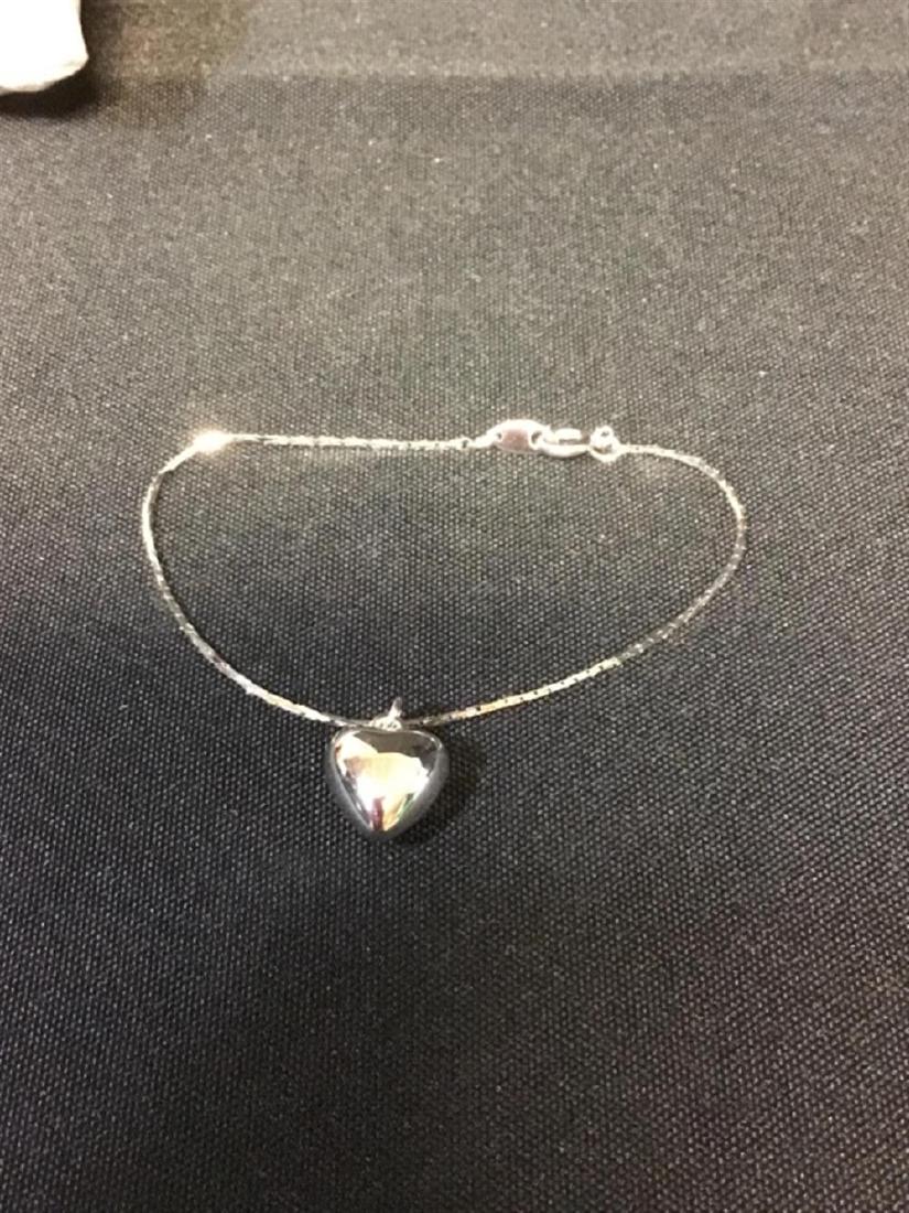 Silver toned bracelet with heart charm (1 of 1)