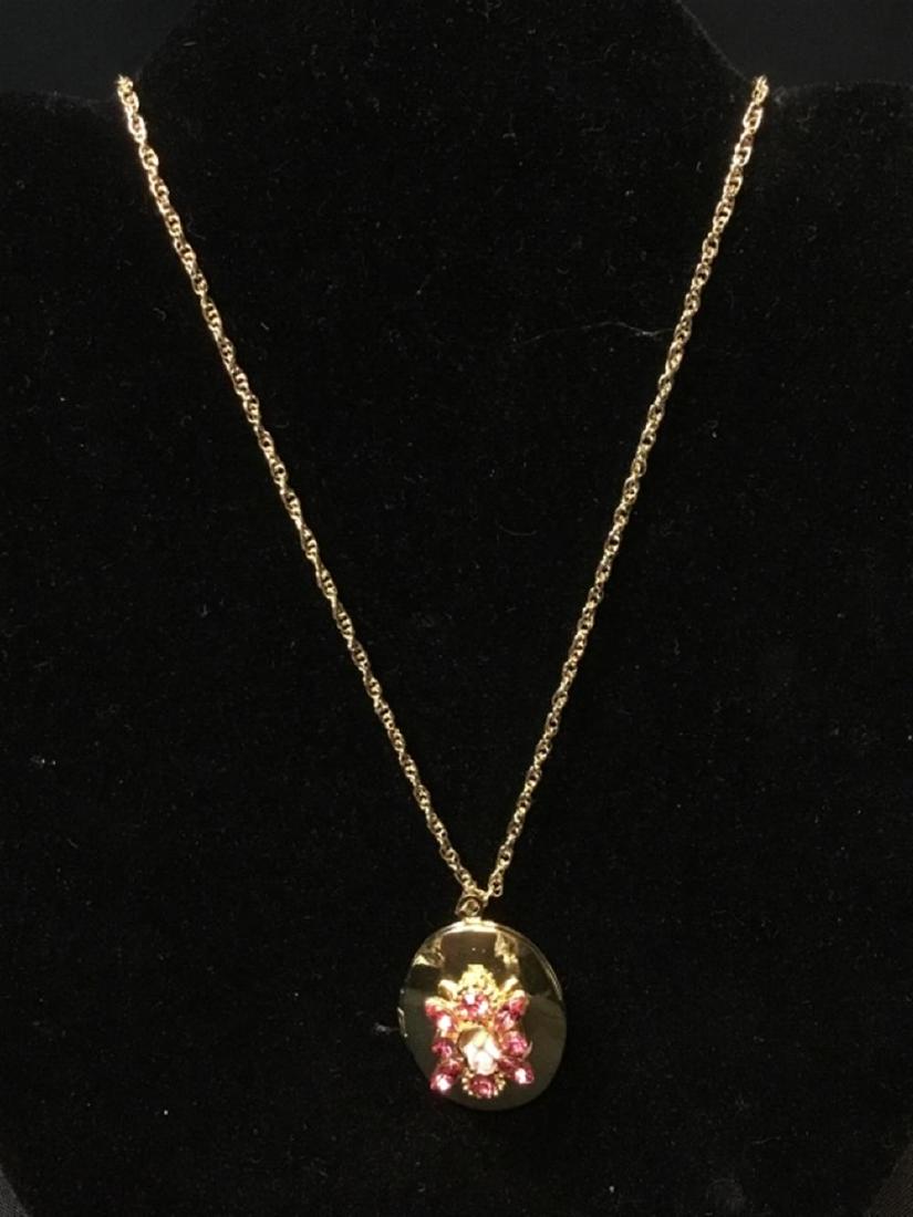 22 inch gold tone pink stone with flower locket: 22 inch gold tone pink stone with flower locket Goldtone pink stone flower locket
