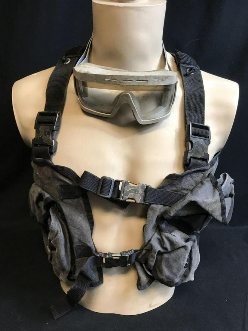 The Hunger Games: Mockingjay – Part 1 2 (2014-15) -: The Hunger Games: Mockingjay – Part 1 2 (2014-15) - Rebel Vest and Goggles.; This lot is for a military style vest and goggles distressed for use in the last two films in the hit Hunger Games series