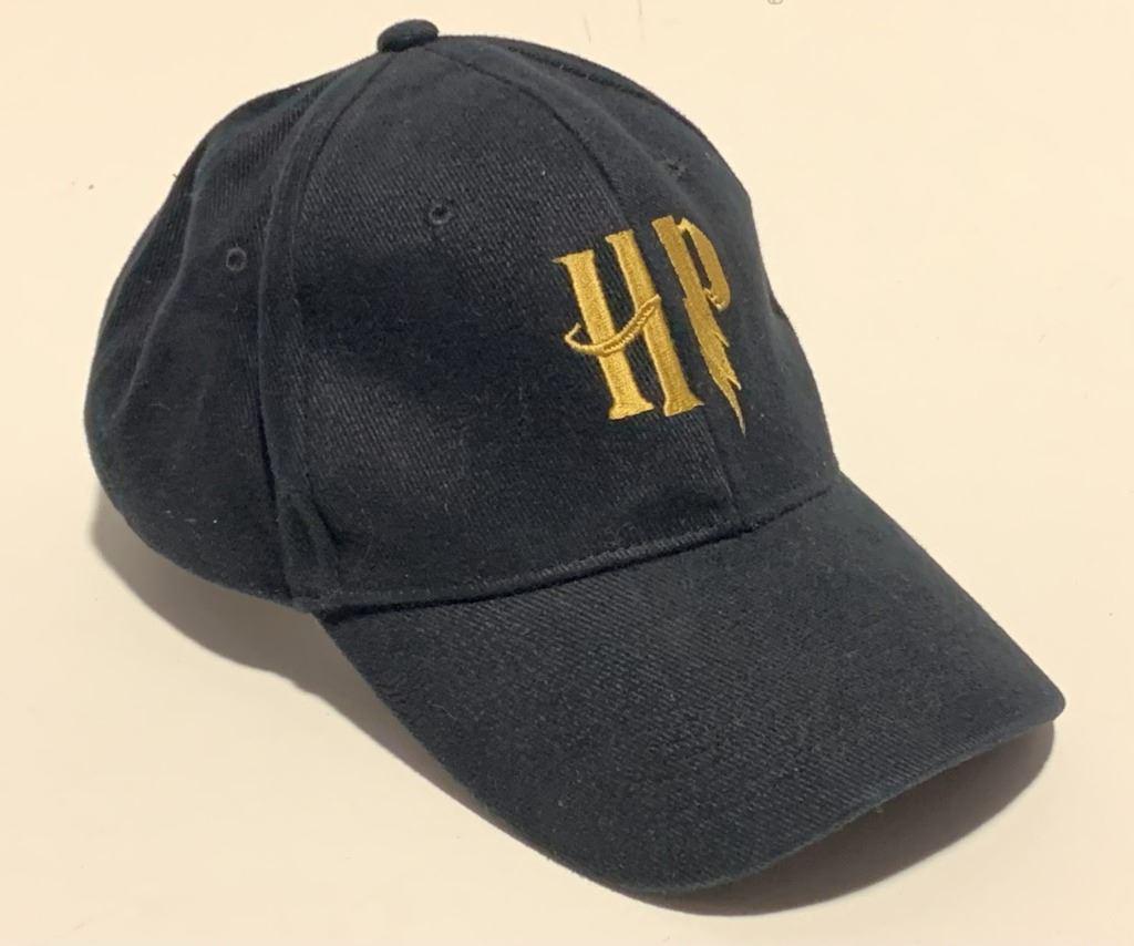 Harry Potter Franchise - Crew Cap (New): Harry Potter Franchise - Crew Cap (New). Original crew cap used in the 'Harry Potter' fantasy film franchise. The series stars Daniel Radcliffe, Rupert Grint, and Emma Watson as the three leading char