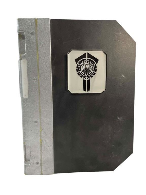 Battlestar Galactica (2004 - 2009) - Galactica Crew Binder: Battlestar Galactica (2004 - 2009) - Galactica Crew Binder.Measuring 11 1/2" x 9 1/4".Binders such as these can be seen being carried around by members of the Galactica crew. The contents of these bin