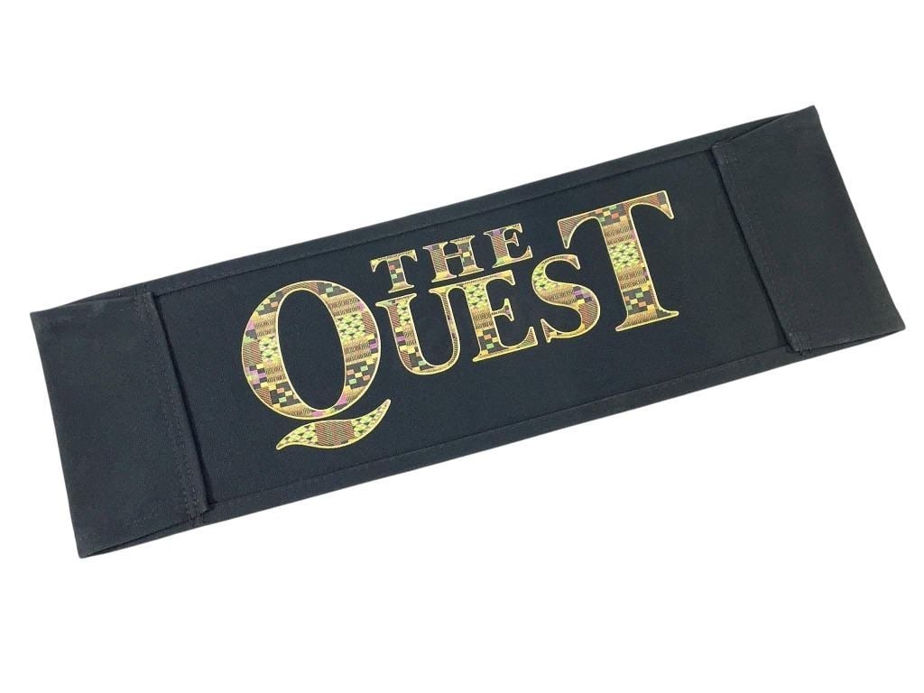 The Quest (1996) - Chairback: The Quest (1996) - Chairback.Measuring 7" x 20 1/2".Original chairback used in the production of the Jean-Claude Van Damme directed/starring martial arts adventure film 'The Quest' (1996), which