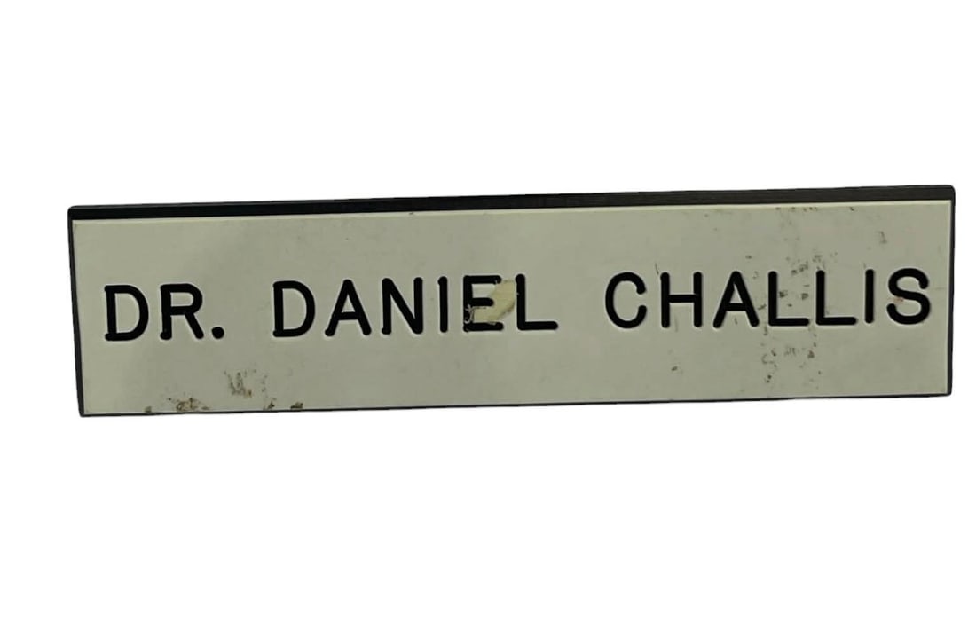 Halloween III: Season of the Witch (1982) - Dr. Daniel Challis (Tom Atkins) Medical Name Badge: Halloween III: Season of the Witch (1982) - Dr. Daniel Challis (Tom Atkins) Medical Name Badge.Original medical name badge worn by "Dr. Daniel Challis", played by Tom Atkins in the Tommy Lee Wallace