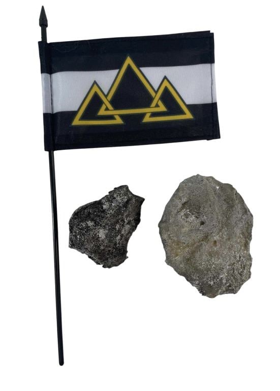 Black Adam (2022) - Kahndaq Flag And SFX Building Debris: Black Adam (2022) - Kahndaq Flag And SFX Building Debris.Measuring 13" for the stick and 4" x 6" on the flag.Building Debris made of foam.Original Kahndaq flag and two building debris pieces used on