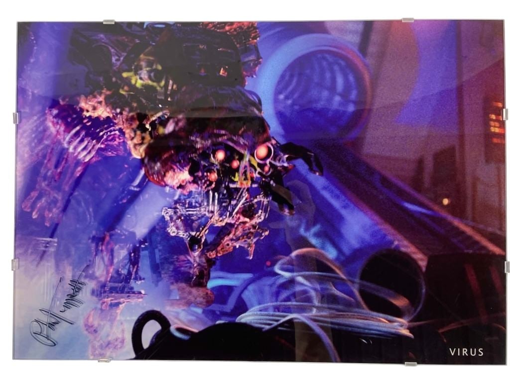 Virus (1999) - Phil Tippett Signed Production Still: Virus (Phil Tippett Collection 1999) - Phil Tippett Signed Production Still.Measuring 14" x 20".Phil Tippett has signed the outside of the glass.Original photo that hung in Phil Tippett studio from th